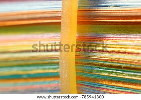 Extreme close up shot of stack of color papers