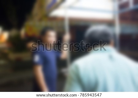 blur background of man cooking food for sell at street market food.