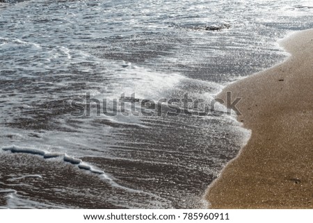 a deserted beach with waves