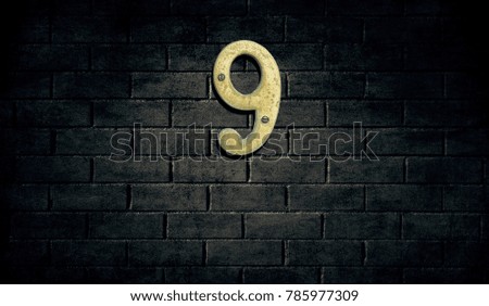 Old house number sign on wall
