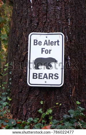 'Be Alert for Bears' Sign Posted on a Tree