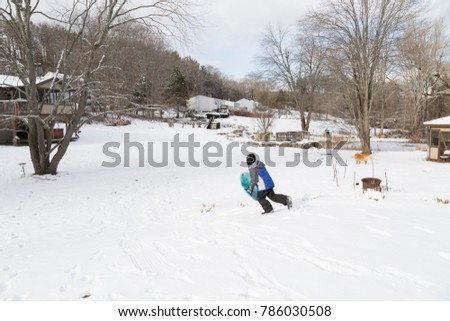 kid with sled