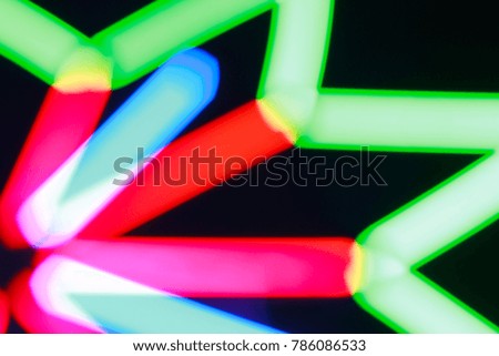 Abstract: Blurred bokeh of colorful lights background at night festival. 