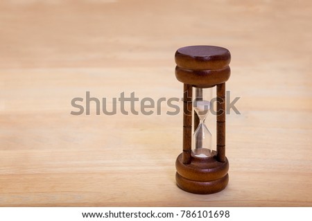 Hourglass on Wood Table