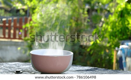 Boiling water into a bowl with smoke.