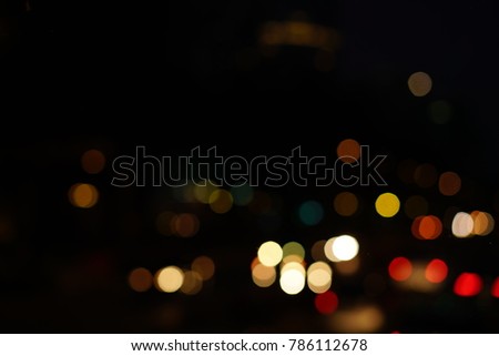 Defocused urban abstract texture bokeh city lights & traffic jams in the background with blurring lights.