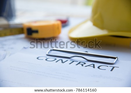 Contract of Construction Architech project signing on construction site. Architect design on planning project with yellow helmet man, stationery set 