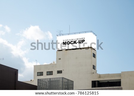 The mock up of two horizontal rectangle blank white billboard on the building and blue sky background with clipping path