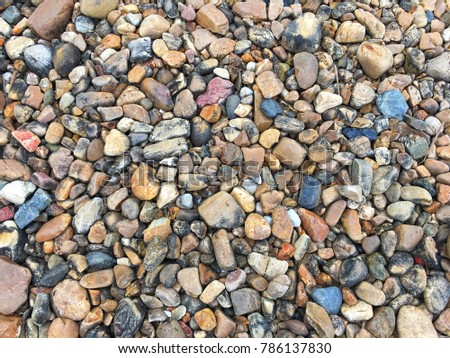 Natural colorful pebbles background.