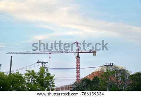 The construction crane on sky background.