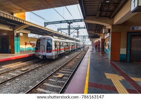 Public Metro departing from Shastri Park station in New Delhi, India, Asia. More than 5 lakhs passengers travel from Delhi Metro. It is the pride of Delhi & India as well. Delhi Metro Rail Corporation Royalty-Free Stock Photo #786163147
