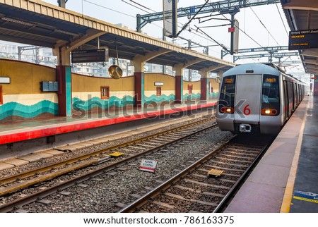 Public Metro arriving at Shastri Park station in New Delhi, India, Asia. More than 5 lakhs passengers travel from Delhi Metro. It is the pride of Delhi & India as well. Metro Rail Corporation in India Royalty-Free Stock Photo #786163375