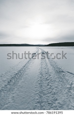 winter landscape, tire tracks on the snow, snow road