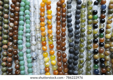 colorful prayer beads put side by side