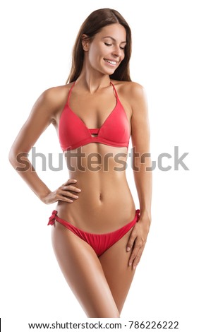 Fit young woman in a bikini isolated on white background