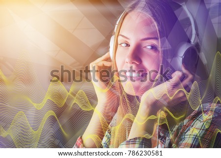 Portrait of attractive european woman listening to music through headphones on abstract background with digital waves. Hobby concept. Double exposure 
