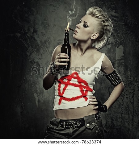 Punk girl smoking a cigarette Royalty-Free Stock Photo #78623374