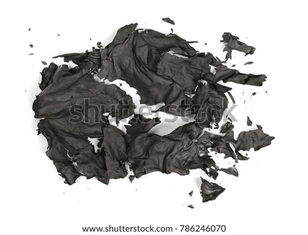 Burned, charred paper isolated on white background, top view