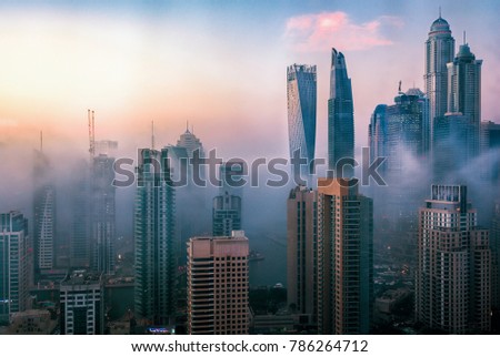 Dubai Marina skyline at sunset with beautiful city center lights, Dubai, United Arab Emirates