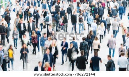 blurred people at a trade fair hall Royalty-Free Stock Photo #786292144