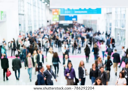 blurred people at a trade fair hall Royalty-Free Stock Photo #786292204