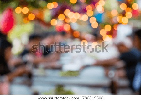 Blurred image of People are having fun at the dinner party, Elegant abstract foreground with bokeh defocused lights.