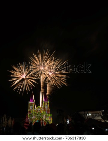 The colorful firework and The Catholic Church , the most beautiful church in eastern Thailand.