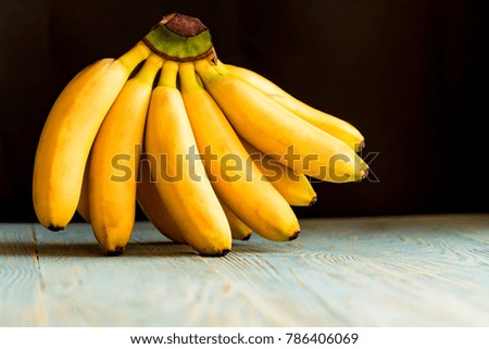 Bunch of bananas on wooden background