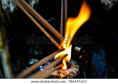 Incense sticks in flames
