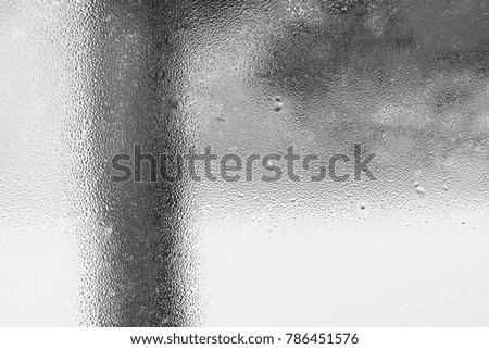The texture of the condensation on the glass in droplets of water. High humidity on the windows. Natural photo in the cold season