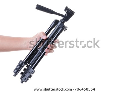 Hand holding a tripod, a photography stabilize and elevate equipment for taking a photo or video on white background