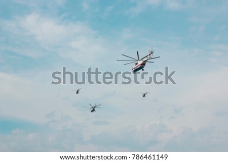 Helicopters planes and fighters in the sky