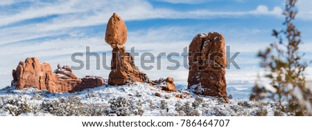 This is the pictures of Balanced Rock at Balanced Rock trail with snow in Winter at Arches National Park