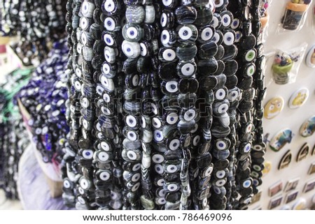 Close-up shot of black bead worn against the evil eye in turkish bazaar for many traditional ancient beliefs