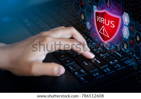 Press enter button on the keyboard computer Protective shield virus red Exclamation Warning Caution Computer in dark with word virus Royalty-Free Stock Photo #786512608