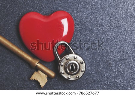 Valentines unlock love concept. Red heart with padlock and key