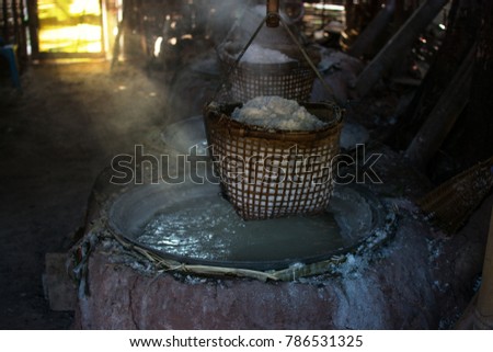 raditional salt making by boiling underground salt water from natural rocksalt pond in  Bo Kluea village. Nan province, Thailand.