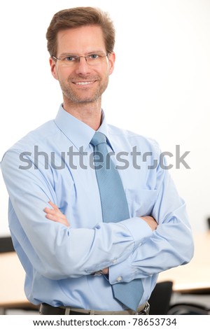 Middle aged and successful businessman in his office