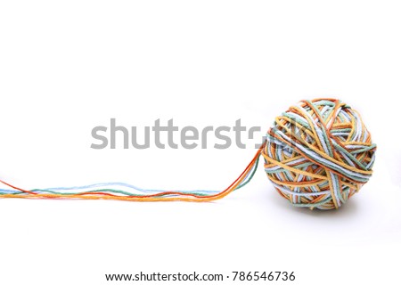 Colorful big thread ball from four color thread. Cotton thread ball isolated on white background. Different color (orange, yellow, green, blue) thread mix concept. Royalty-Free Stock Photo #786546736