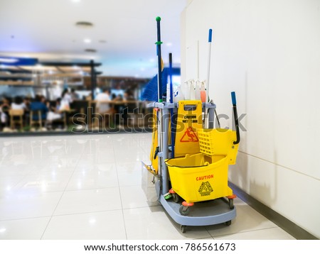 Cleaning tools cart wait for cleaning.Bucket and set of cleaning equipment in the Department store Royalty-Free Stock Photo #786561673
