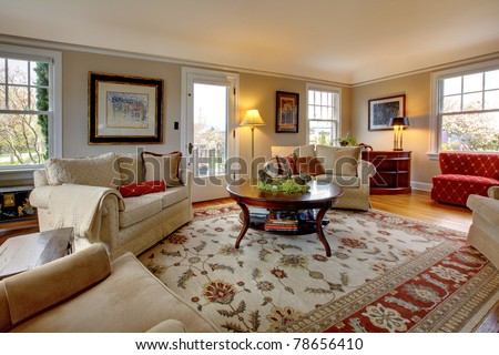 Cozy luxury living room with beige and red