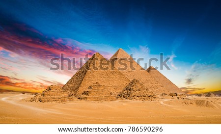 Great Pyramids of Giza, Egypt, at sunset Royalty-Free Stock Photo #786590296