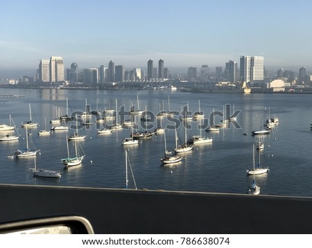 boats anchored in Coronado bay san Diego city sky line in back ground   