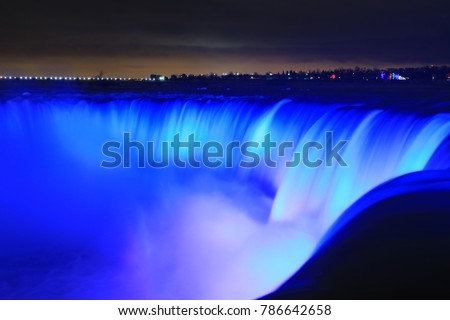 Night image of the illuminated Niagara Falls in Canada.  One of the 7 wonders of the world. Royalty-Free Stock Photo #786642658