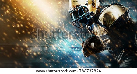 American football sportsman player on stadium running in action. Sport wallpaper with copyspace. Royalty-Free Stock Photo #786737824