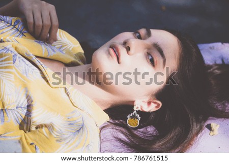 Portrait of thai yellow shirt adult beautiful girl relax time, in Vintage Style