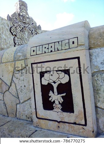 Sign and logo / coat of arms of Mexican state Durango on Mayan statue Homeland Monument at Paseo de Montejo, most famous boulevard in Merida, beautiful colonial city in Yucatan, Mexico