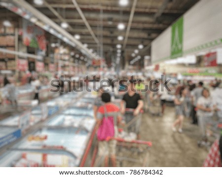 People shopping in mall. Blurred for background.