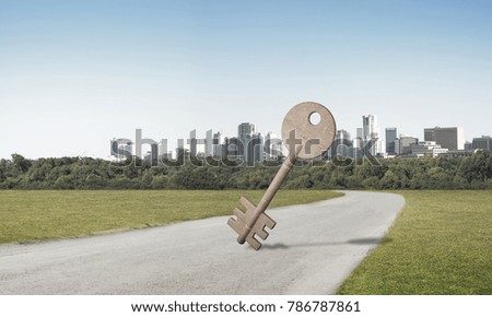 Key stone figure as symbol of access outdoor against natural landscape
