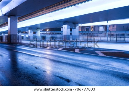 Night scene of asphalt road and modern bridge